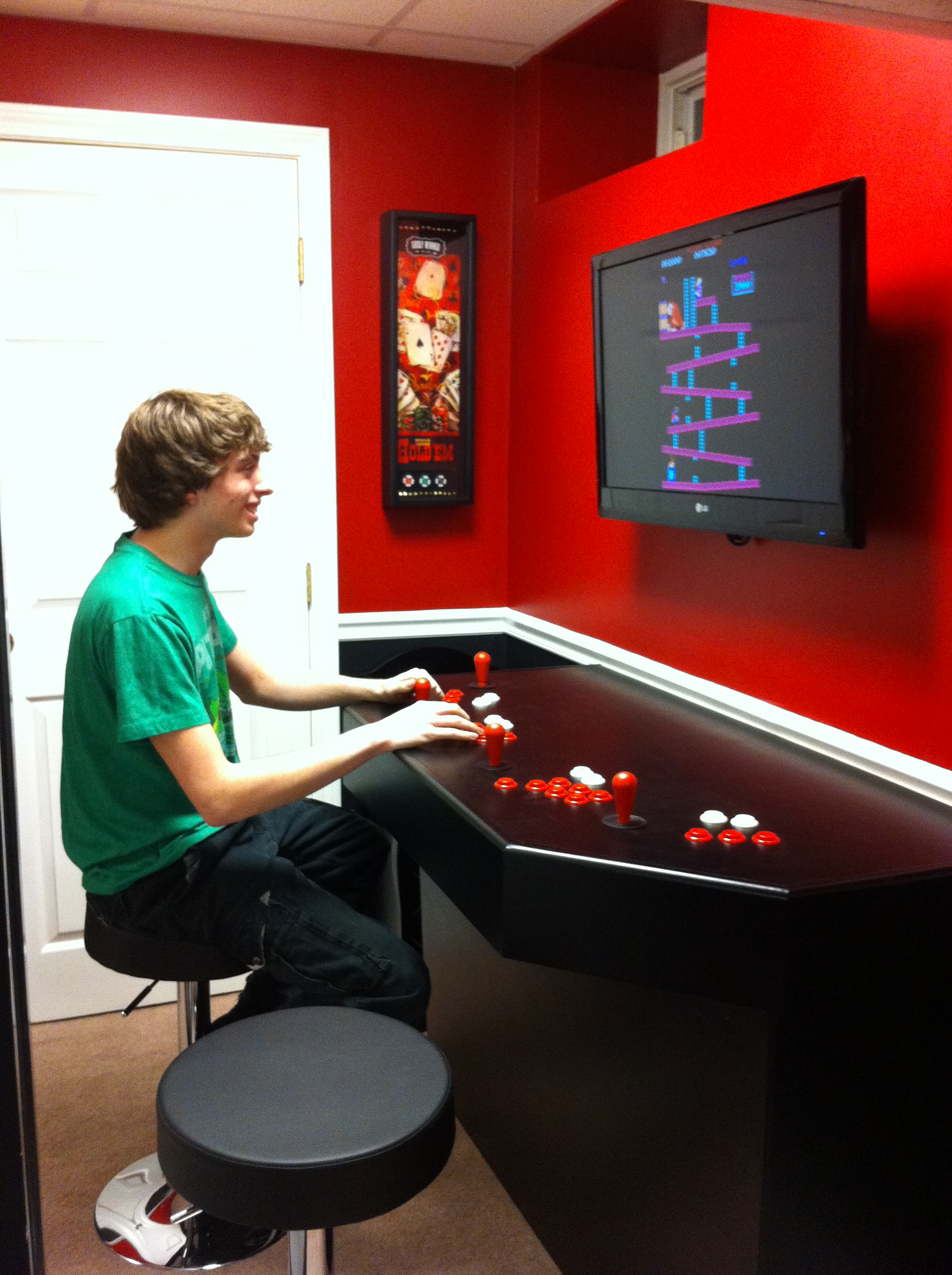 Full cabinet view, four player stations visible