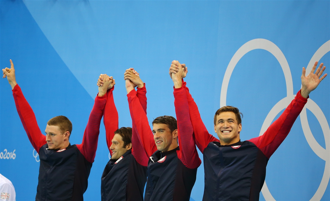Olympic Swim Team Celebrating Gold Medal Win