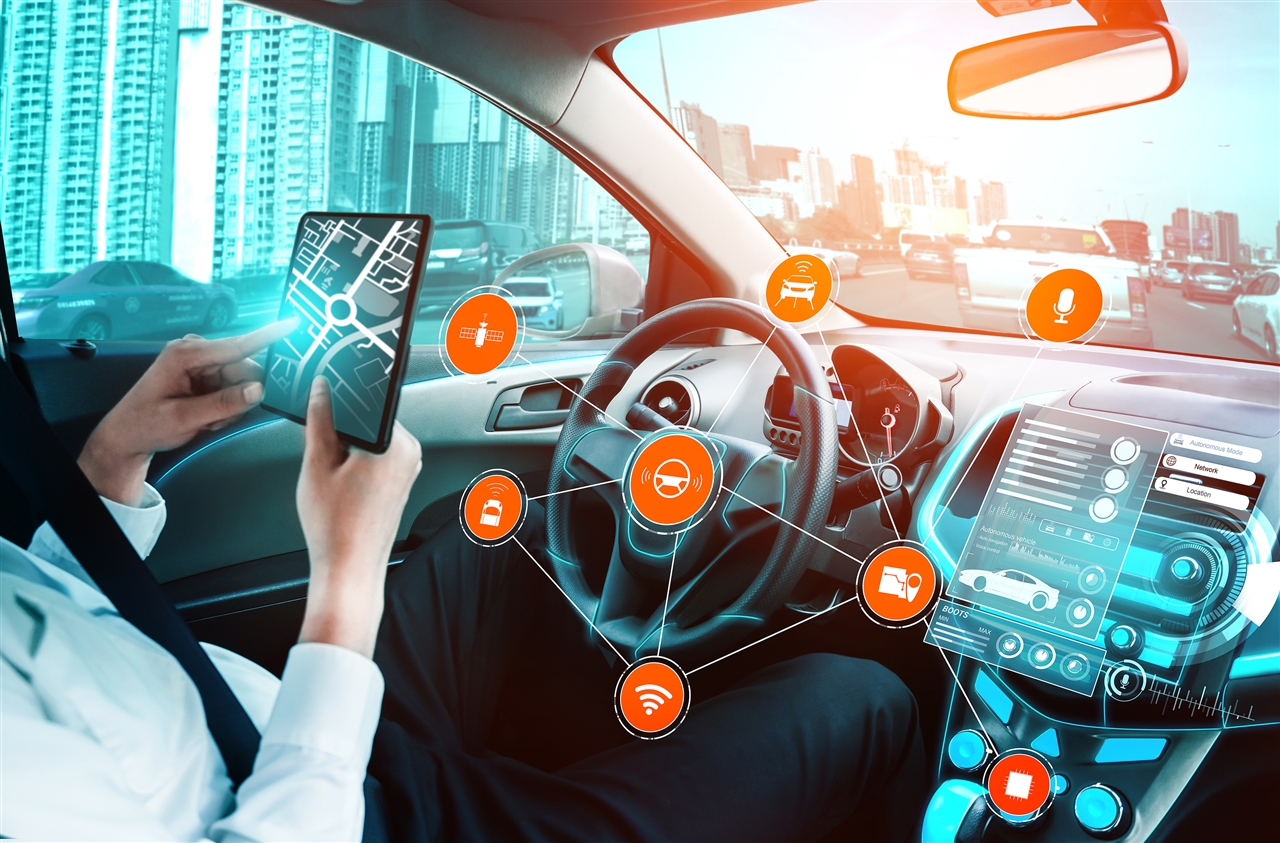 Automated driving car cockpit with driver on tablet