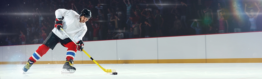 Hockey player skating with the puck
